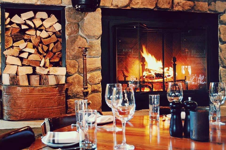 7 Cozy Bars & Restaurants With Fireplaces To Keep You Warm All Winter