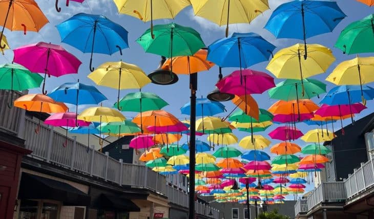 A Magical Rainbow Of 500+ Floating Umbrellas Decorate This Charming Coastal Town—And It&#8217;s Just 90 Minutes From Boston