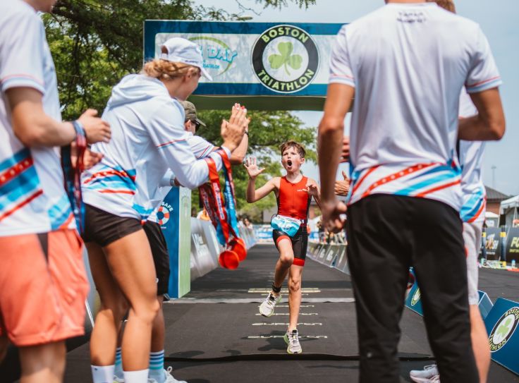 kid finishing triathlon