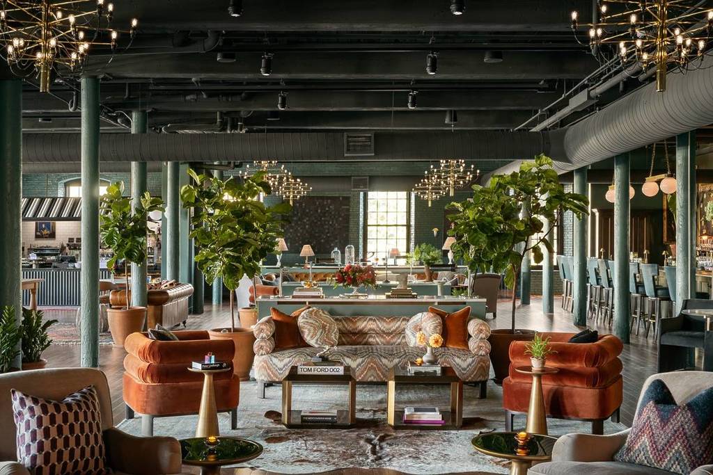 lobby of lincoln hotel biddeford maine with leather chairs, fur, plants
