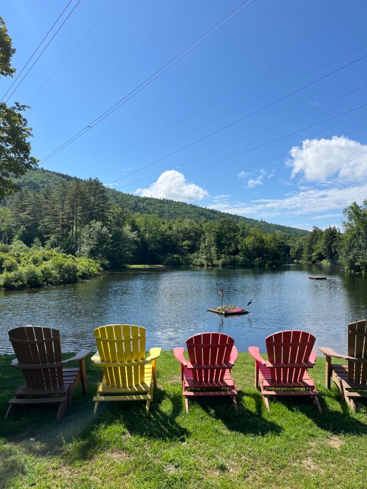 adirondack chairs overlooking green mountains