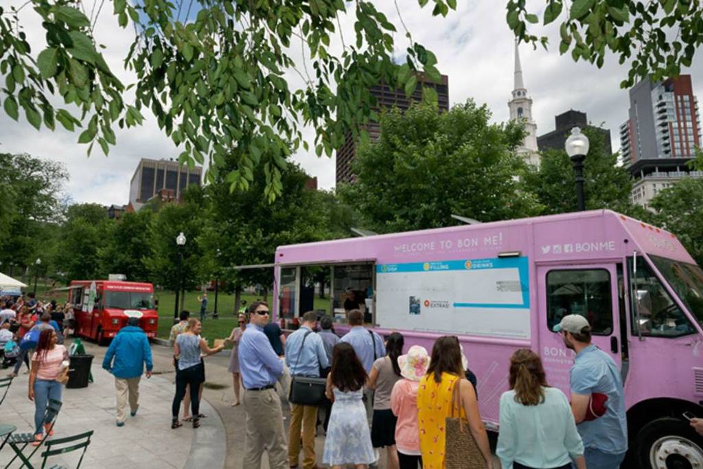 people in line at a pink food truck at Boston Common