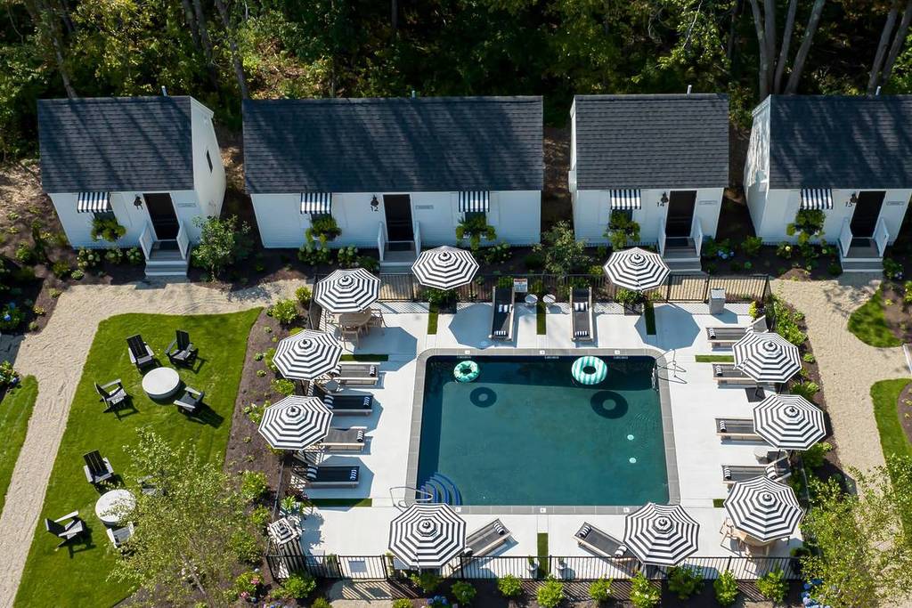 aerial view of pool and cottages