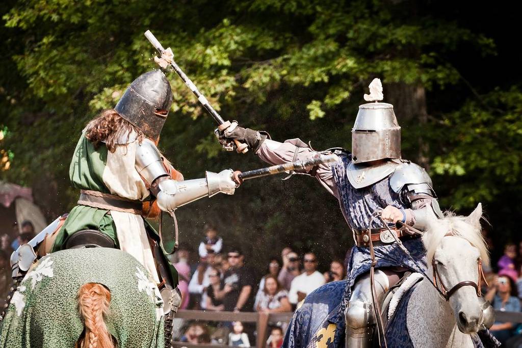 knights jousting on horses at renaissance faire