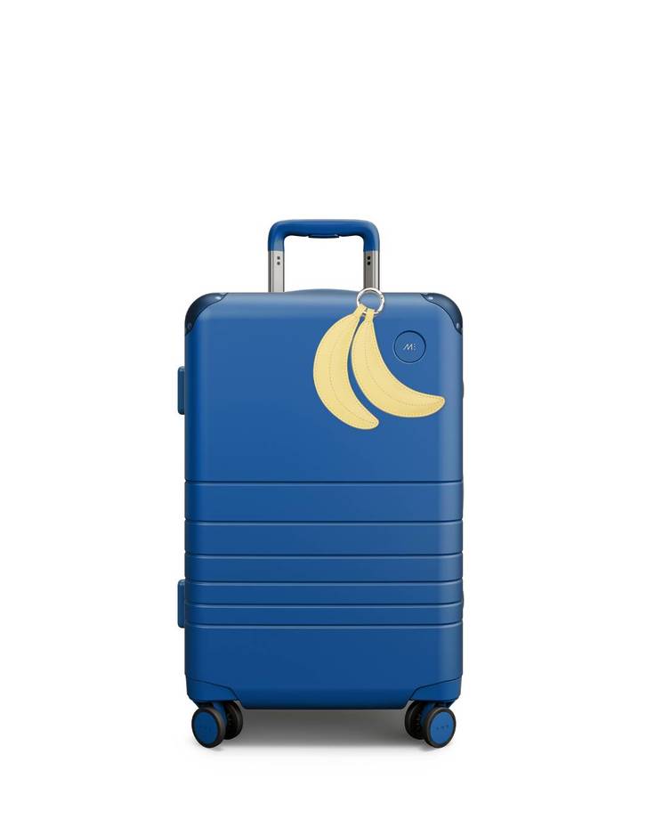 monos x simonmiller costal plue luggage with yellow banana charm