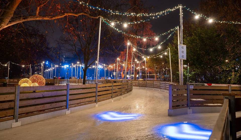 A Waterfront Ice Skating Loop Arrives In Boston Tonight—With Picture-Perfect Skyline Views, Cozy Chalets, And Hot Belgian Waffles