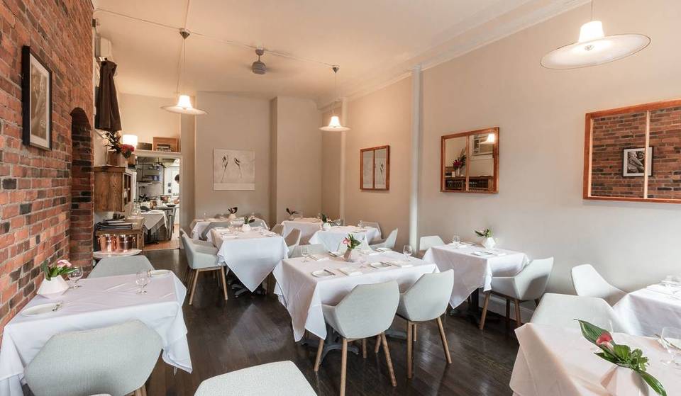 This Intimate 12-Top Restaurant In A Tiny Cambridge Village Boasts A James Beard Semifinalist Tasting Menu— With Cozy Brick Walls And White Tablecloths