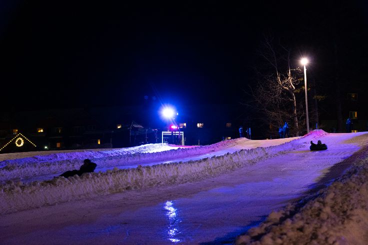 nighttime snow tubing