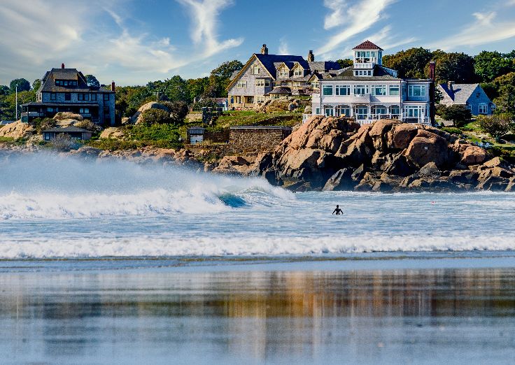 Good Harbor Beach is a picturesque and popular destination located in Gloucester, Massachusetts. The large, white cottage is known as Sherman Cottage, built in the 1880's.