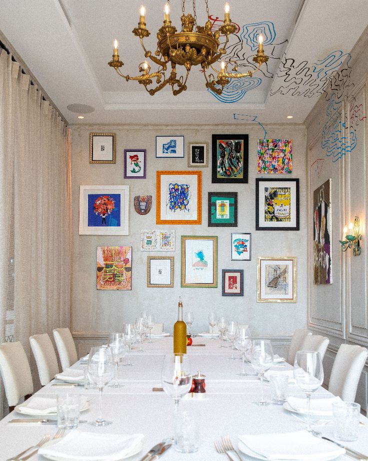 elegant restaurant with colorful art on walls