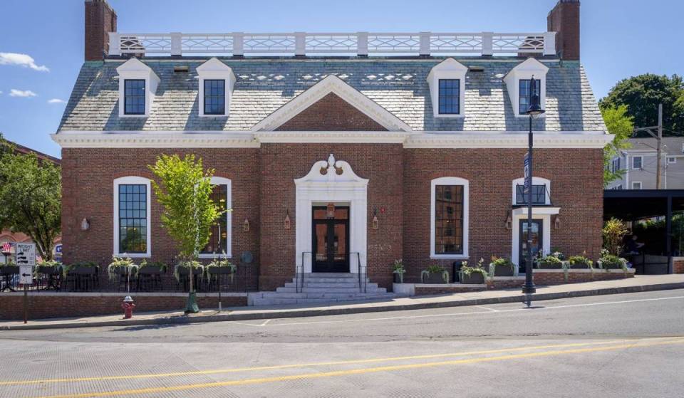 Just 9 miles south of Boston, this 100-year-old Jazz Age bank transformed into a charming neighborhood market