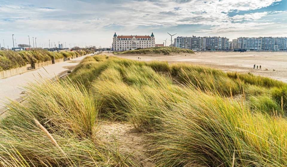 Forget the typical beach resorts: this coastal town boasts the widest beach on the Belgian coast, complete with open-air movies and music festivals!