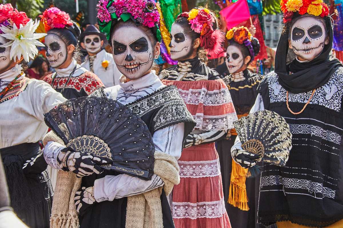 Catrina costumes at a Dia de los Muertos celebration