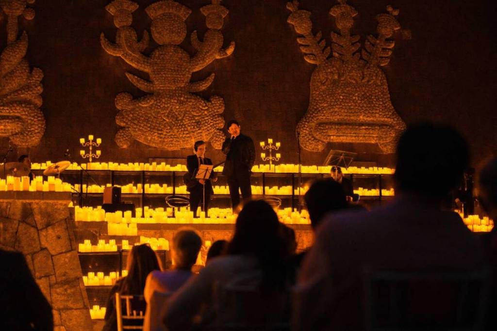 A panoramic view of Chapultepec Forest illuminated by thousands of candles during a Candlelight concert.