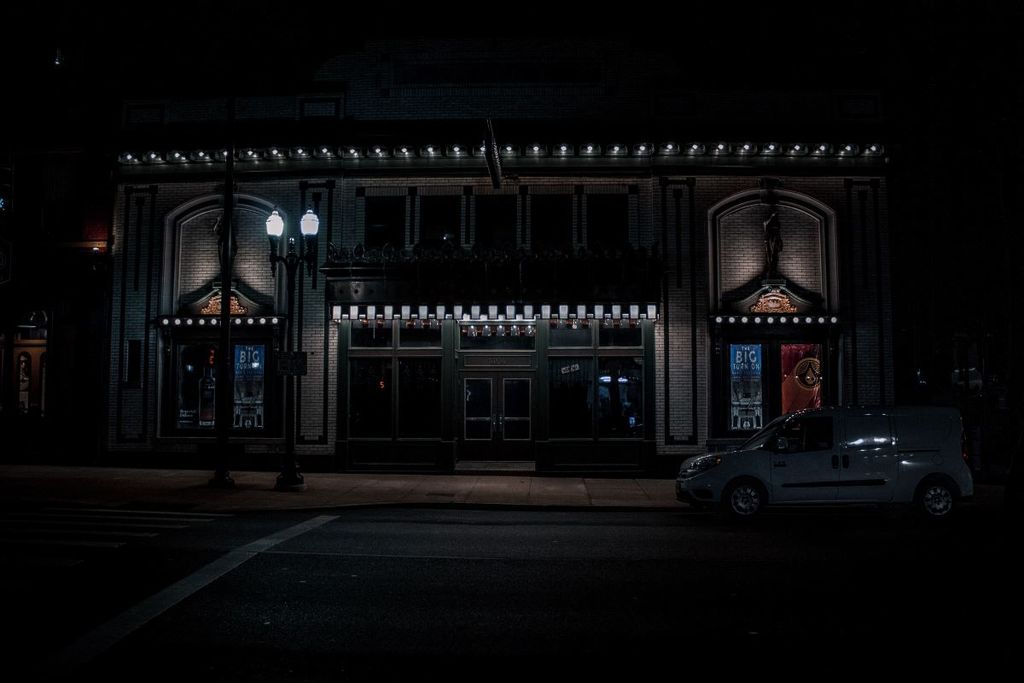 The exterior of the Woodward Theater in Cincinnati at night.