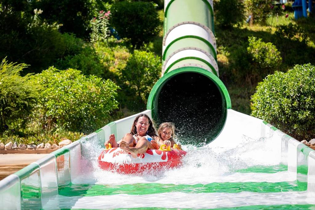 woman and child on a buoy slide at aqualand algarve