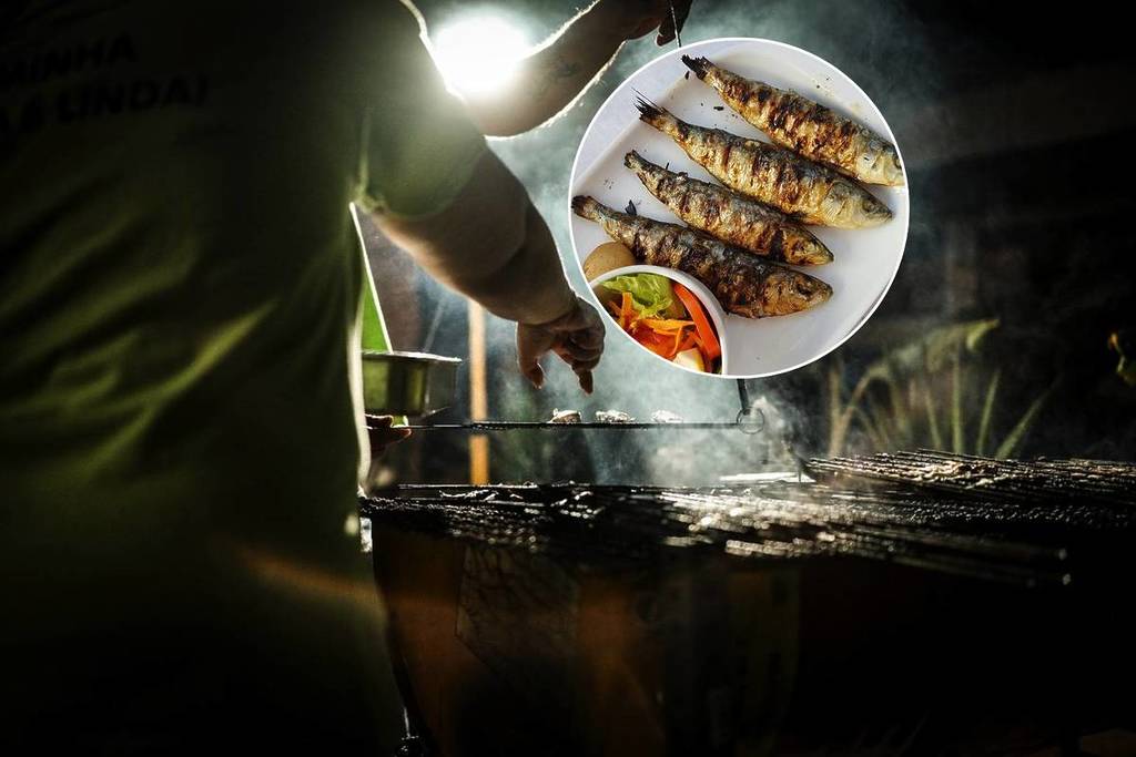 homem a assar peixe num fogareiro, sardinhas assadas em lisboa
