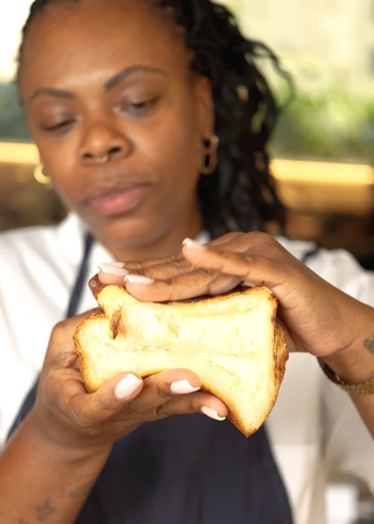 woman crushing a Shokupan bun