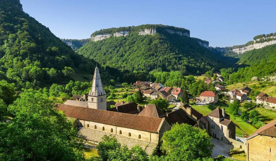 Just 2 hours from Lyon, between an imperial abbey, spectacular caves and waterfalls, this tiny village of less than 200 inhabitants is a true paradise &#8211; and you probably don&#8217;t know it!