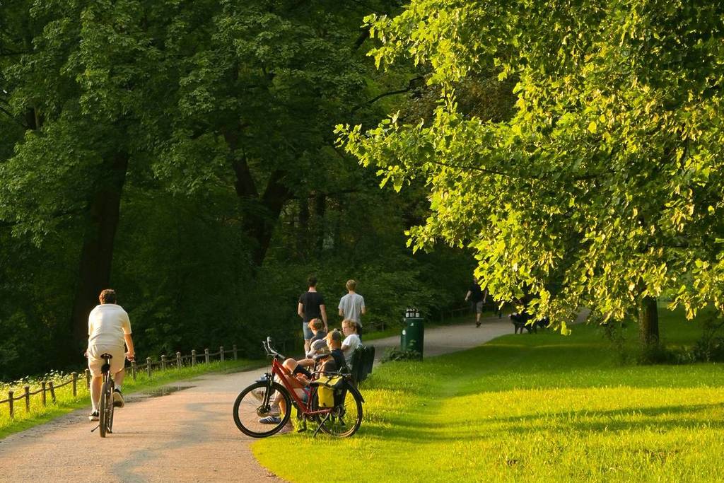 People cycling in the 200,000-square-meter park near Milan