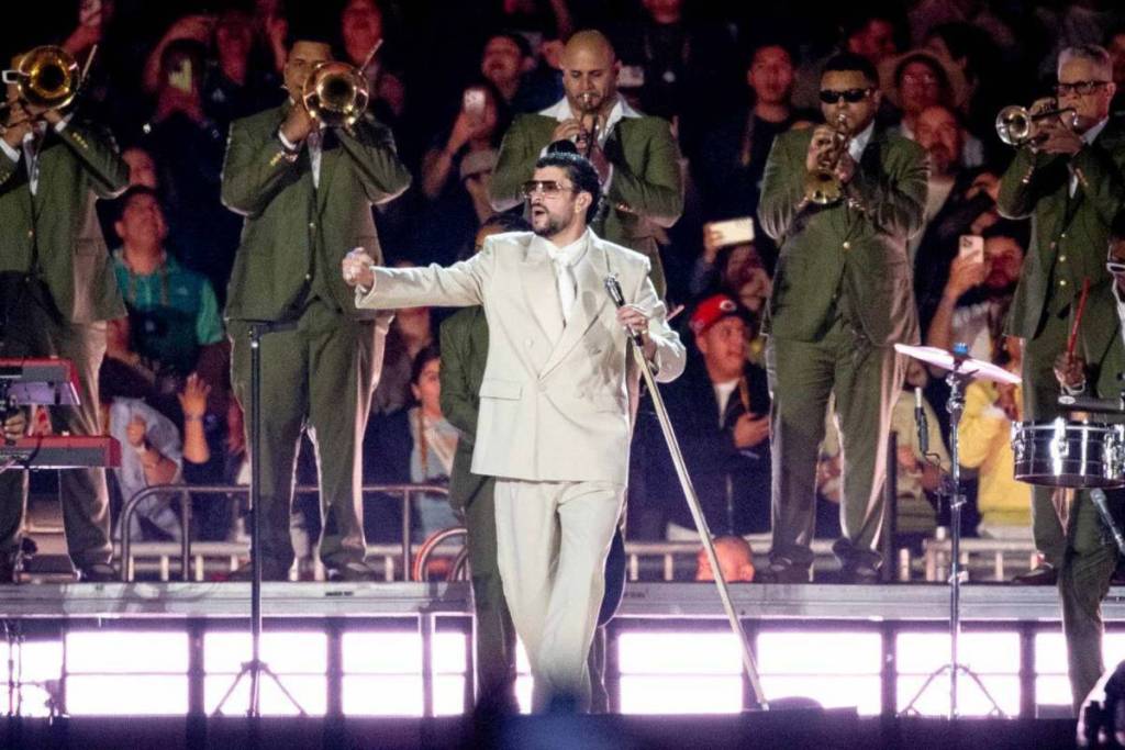 Bad Bunny performs on stage during a stop on his world tour