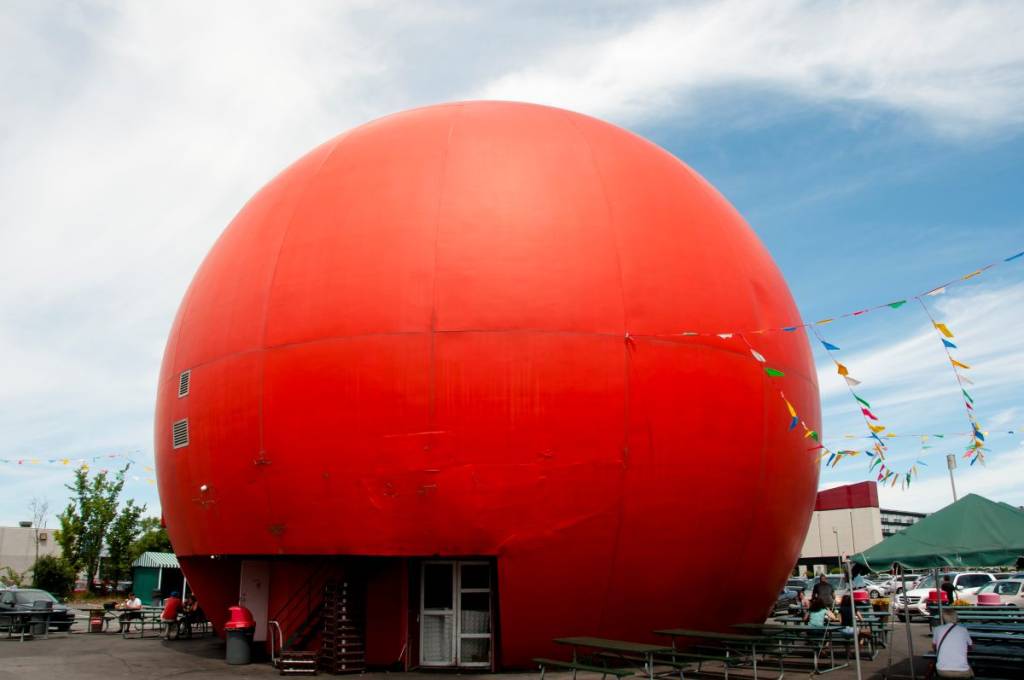 Iconic Montreal—the Orange Julep on Décarie Boulevard, the fast-food restaurant housed in a giant concrete orange, is the most beautiful spot in Montreal to watch the sunset