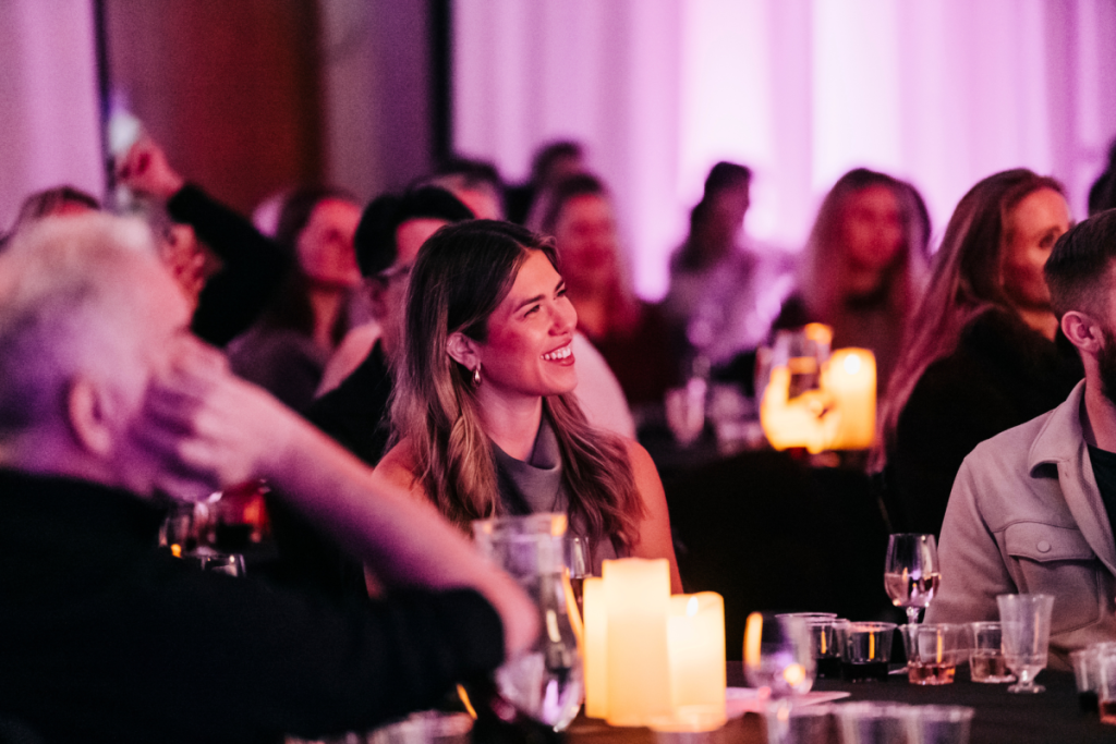 Group of people laughing at “An Idiot’s Guide to Wine”