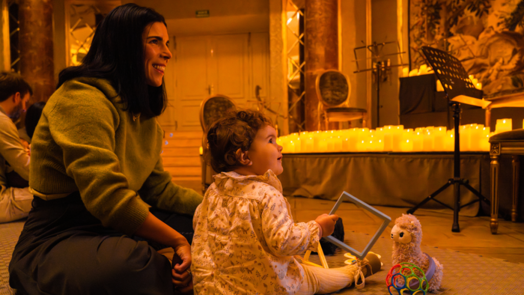 Photo of a mother and her baby at a Candlelight concert