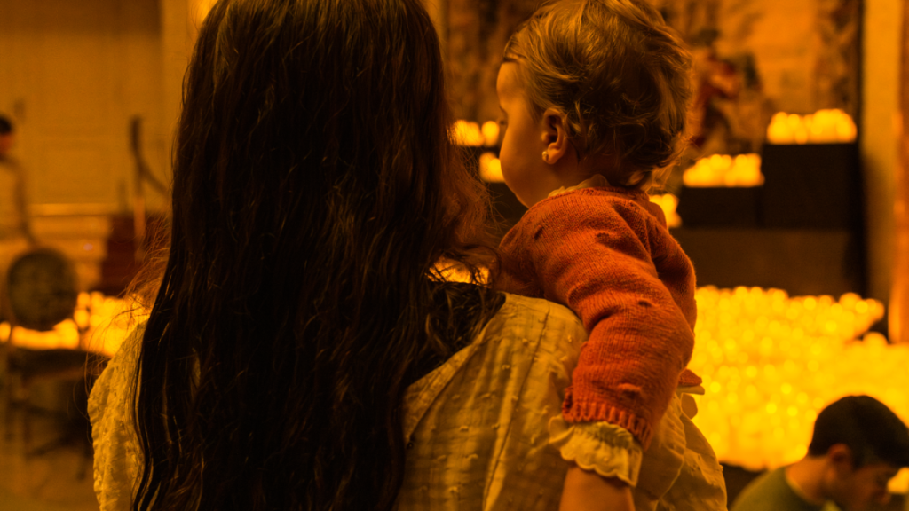Photo of a mother and her baby at a Candlelight concert