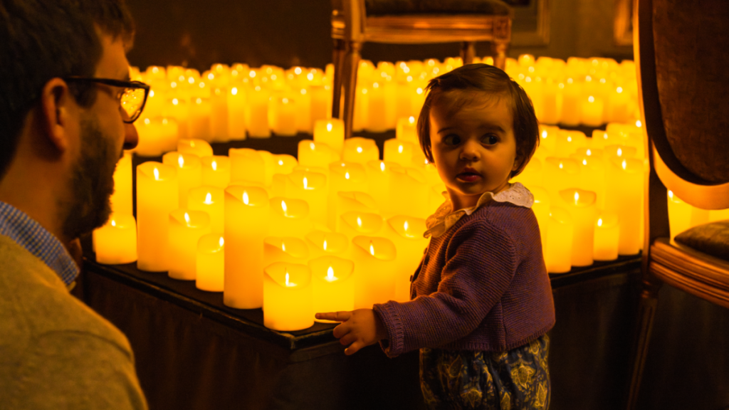 Photo of a father and his baby at a Candlelight concert