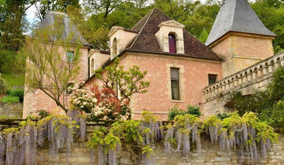 This little-known village on the banks of the Seine is covered in cascades of wisteria for just a few weeks