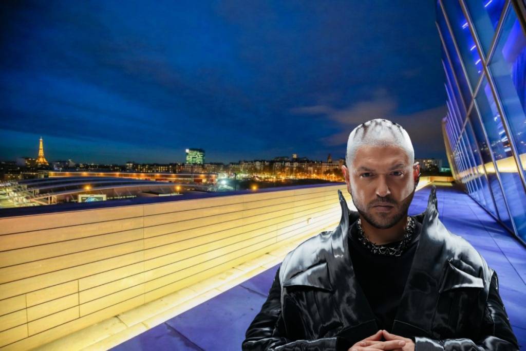 photo of Mosimann against the backdrop of a Parisian rooftop with a view of the Eiffel Tower