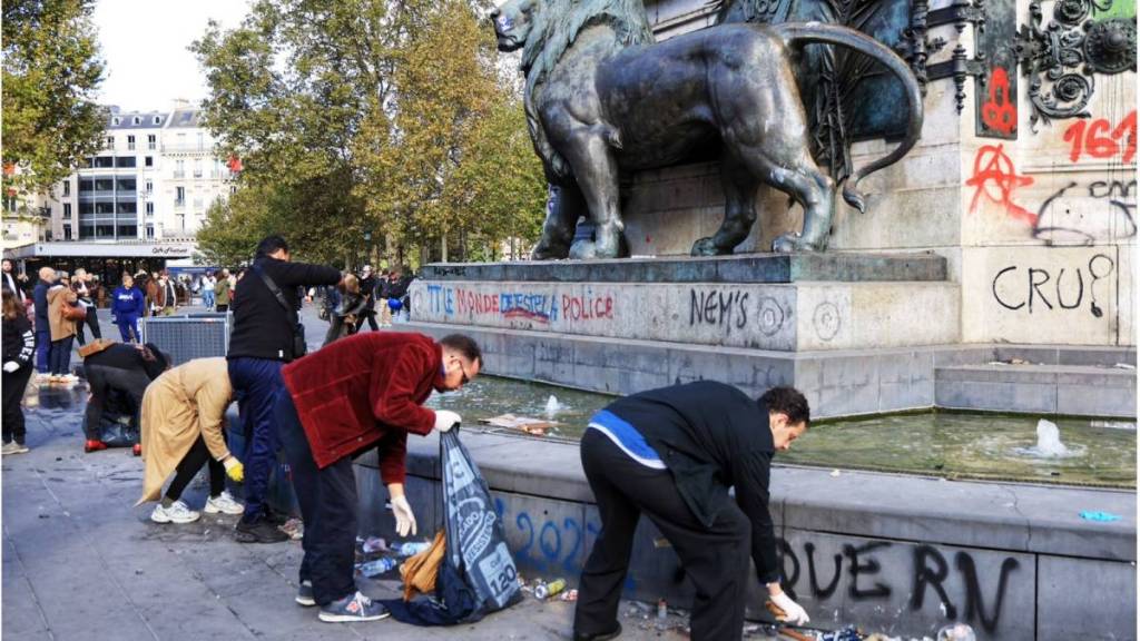 Following the violence on October 17, Parisians are rallying to clean up their neighborhoods alongside nearly 1,000 city workers