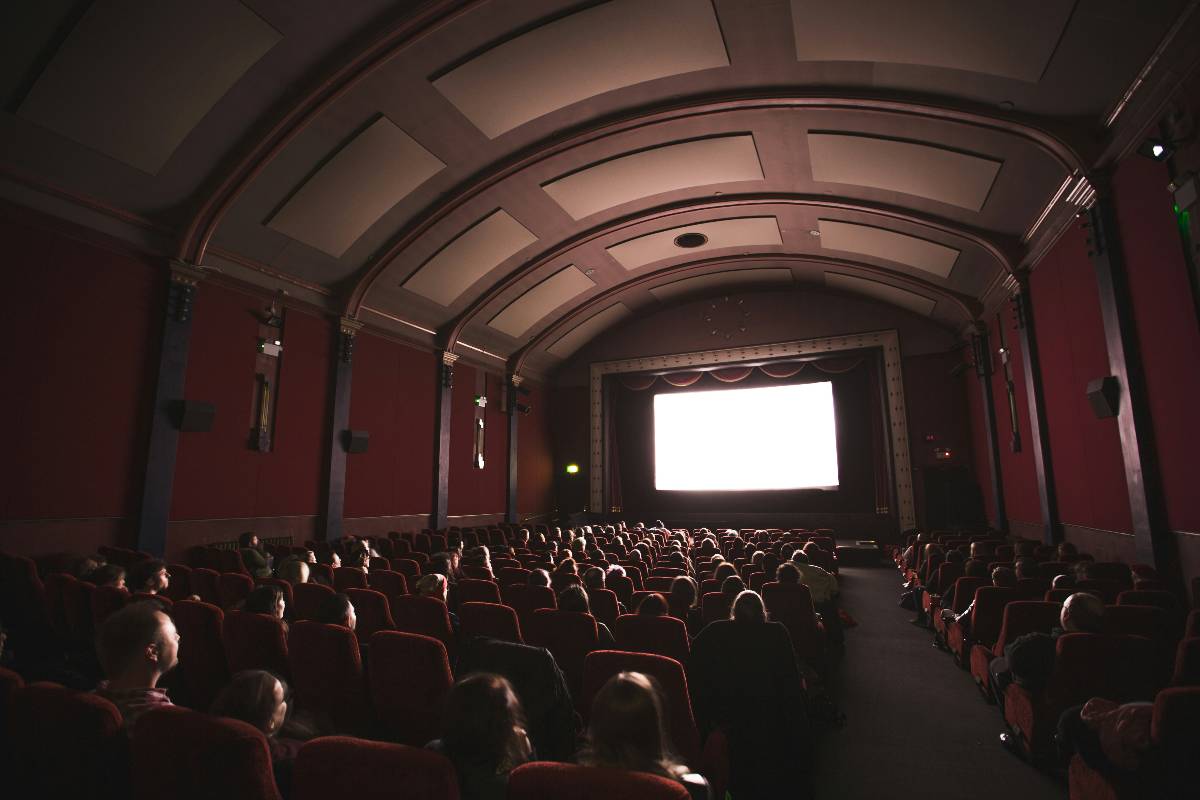 Audiences sat in their seats watching a film at a cinema