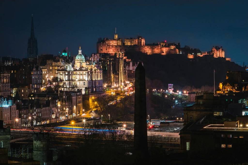 Edinburgh castle and city centre lit up at night