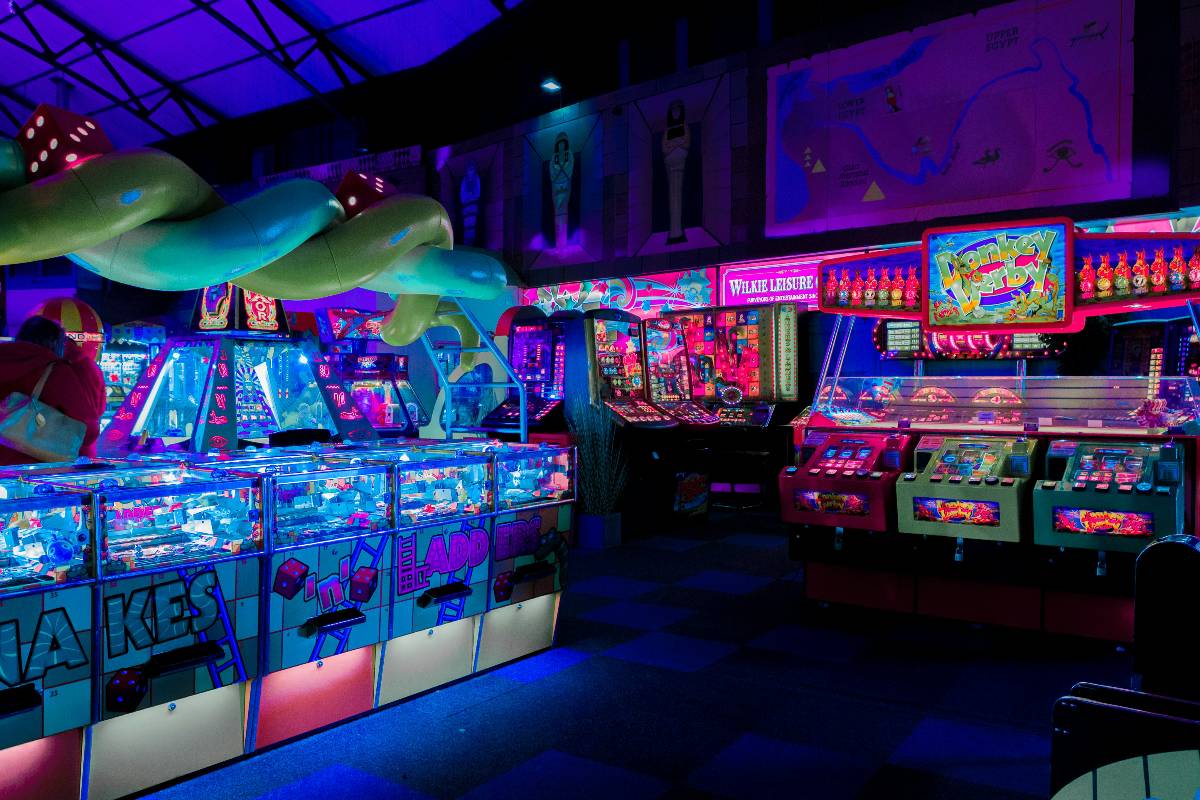 A retro arcade lit up by neon lights