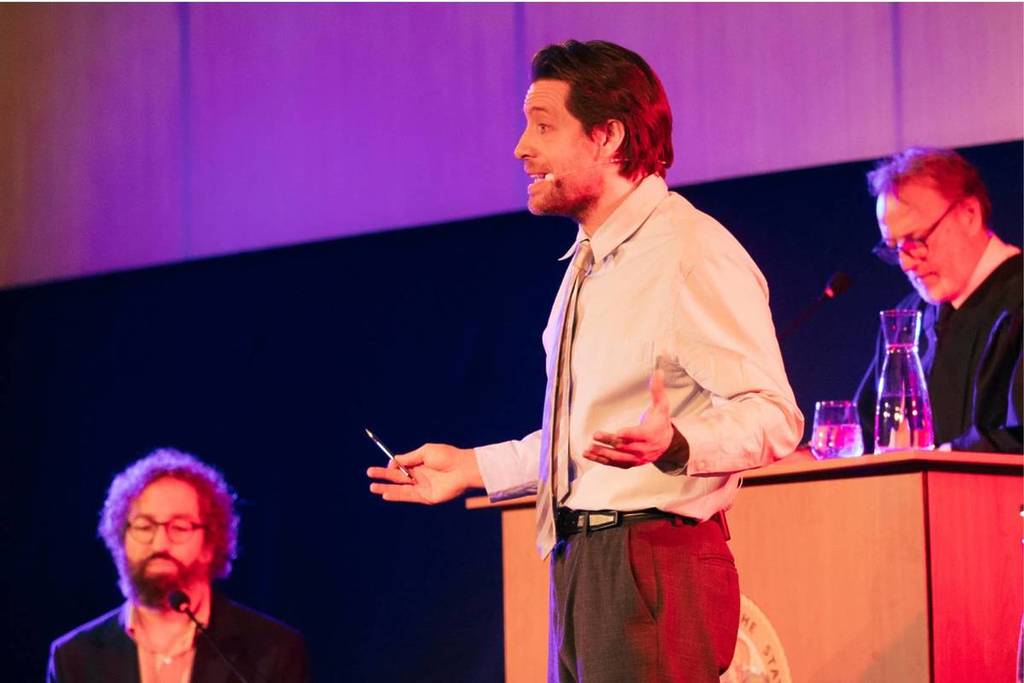 A man addressing the jury at The Jury Experience