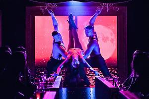 Cabaret performers dance onstage