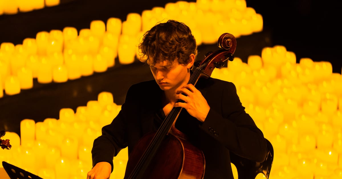 A musician playing the cello at a Candlelight concert