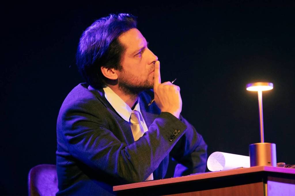 A prosecutor listening intently at The Jury Experience