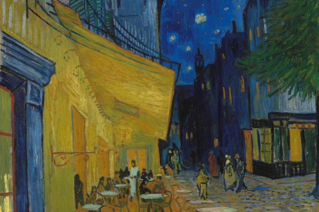 Vincent van Gogh’s world-famous Post-Impressionist painting *Café Terrace at Night*, featuring a lit-up yellow terrace beneath a deep-blue starry sky.