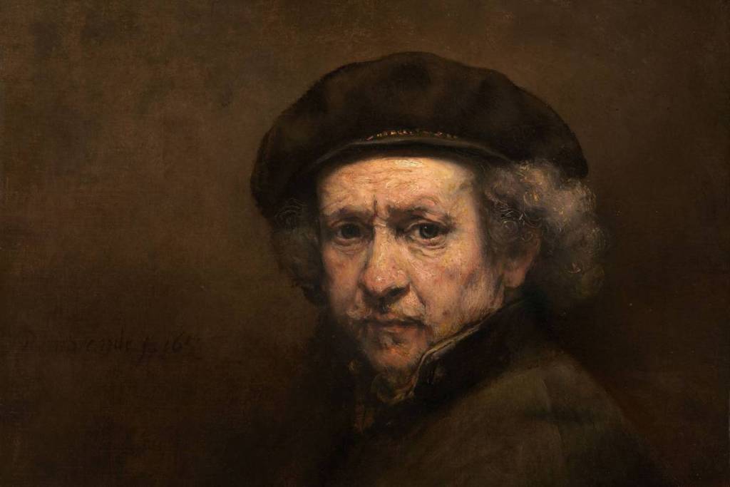 Autorretrato de Rembrandt: Autorretrato de Rembrandt van Rijn en su vejez con una boina negra, en el que su rostro aparece iluminado de forma evocadora sobre un fondo oscuro.