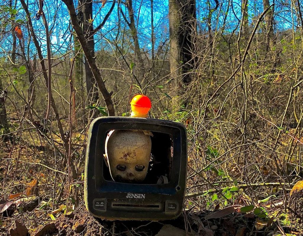 a babydoll head in a TV