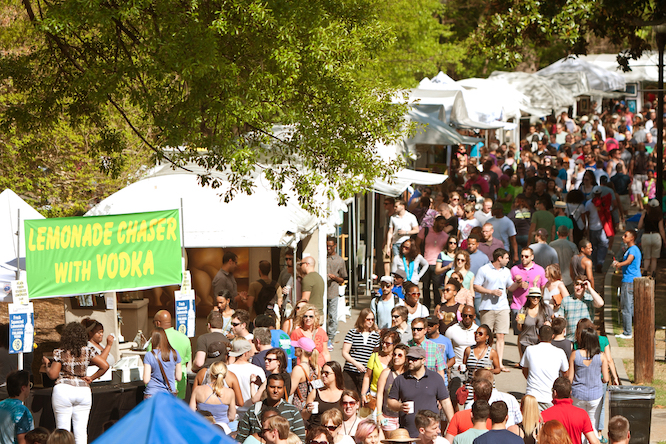 ATLANTA, GA - APRIL 11: An enormous crowd of people moves through the exhibit tents at the annual Atlanta Dogwood Festival in Piedmont Park on April 11, 2015 in Atlanta, GA.