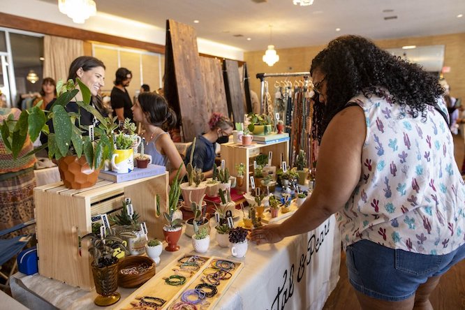someone shopping at the Indie Craft Experience market