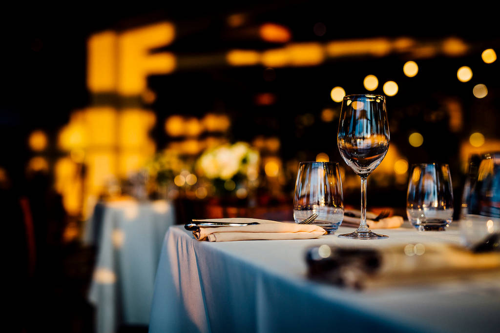 Luxury table settings for fine dining with and glassware, beautiful blurred background. For events, weddings. Preparation for holiday passover, props for weddings, birthdays, and celebrations.