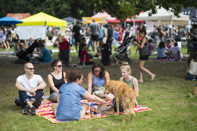 NEW YORK CITY - AUGUST 27, 2017: Crowds of people flock to the seasonal Smorgasburg food fair, the largest in America, serving artisanal foods and drinks in Prospect Park, Brooklyn.