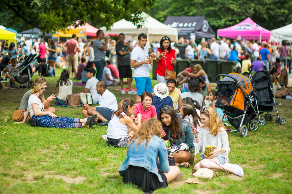 NEW YORK CITY - AUGUST 27, 2017: Crowds of people flock to the seasonal Smorgasburg food fair, the largest in America, serving artisanal foods and drinks in Prospect Park, Brooklyn.