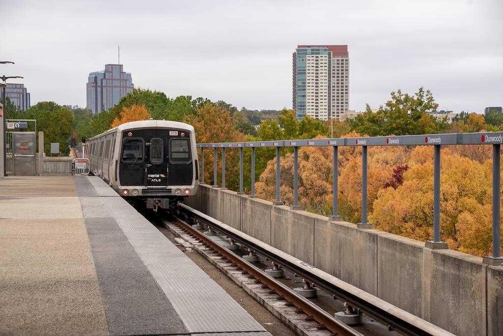 GA, US, Oct 27, 2023: Marta trains and track at Dunwoody stop in beautiful fall season. The old train system runs throughout the downtown Atlanta to parts of the South. The train is not user friendly
