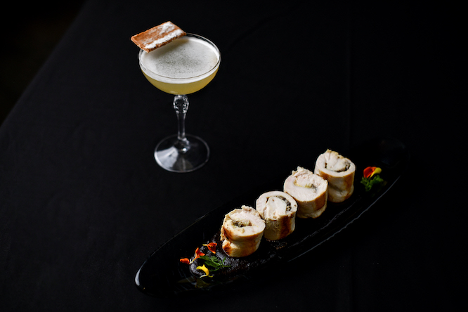 fancy cocktail with a cute snack
